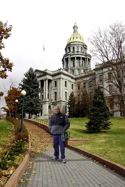 Dave standing in front of a building on an overcast day