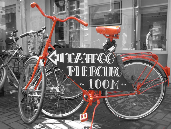 Red bicycle in black-and-white photo